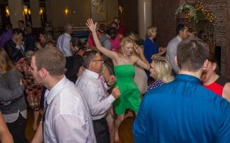 people dancing and enjoying at a wedding